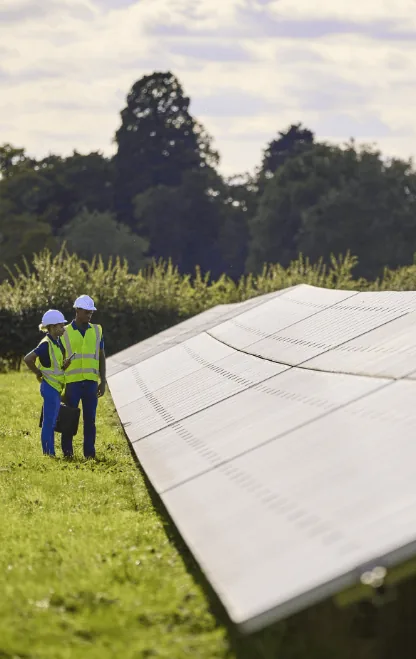 male-and-female-engineers-inspecting-solar-panels-2023-11-27-05-13-39-utc