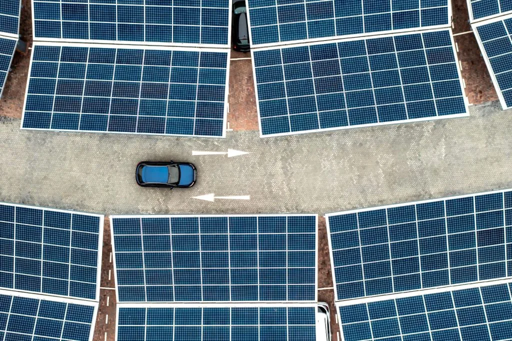 aerial-view-of-solar-panels-at-an-electric-car-cha-2023-11-27-05-08-44-utc
