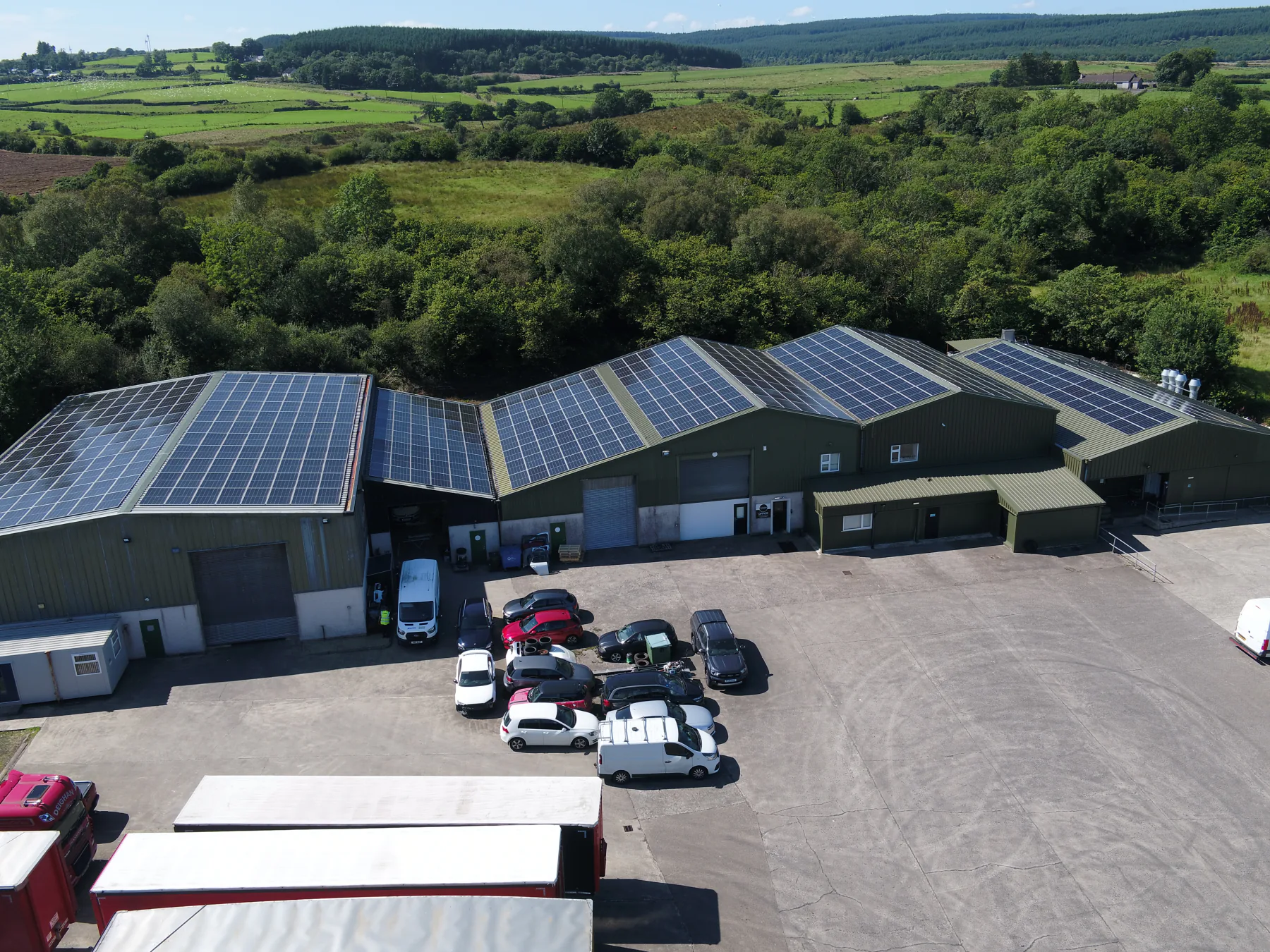 Aerial view of Annie’s Foods’ solar panels and yard, with countryside beyond