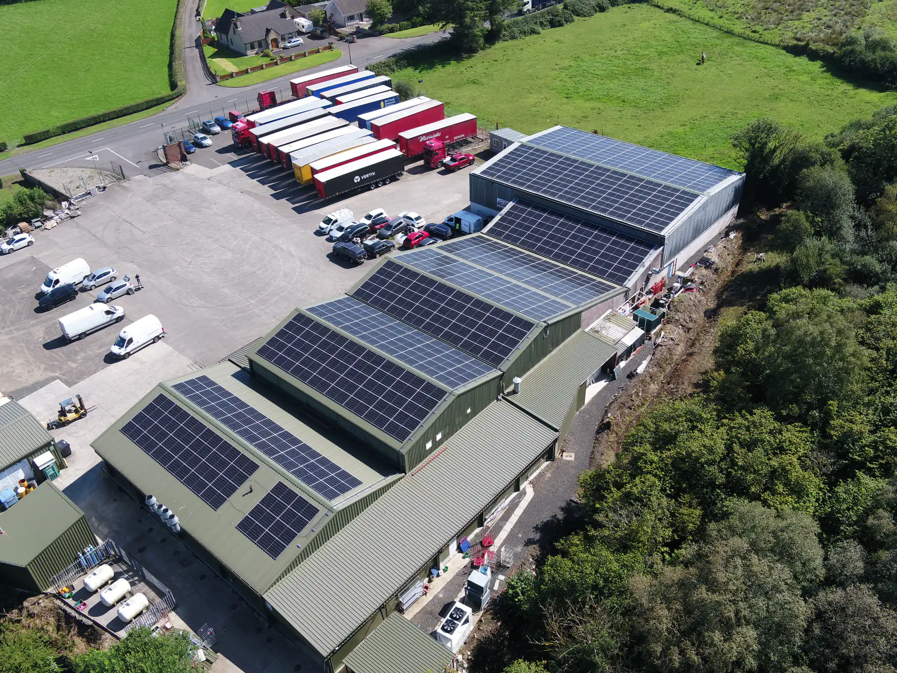 Aerial view of the Annie’s Foods site, showing solar roofs and delivery trailers